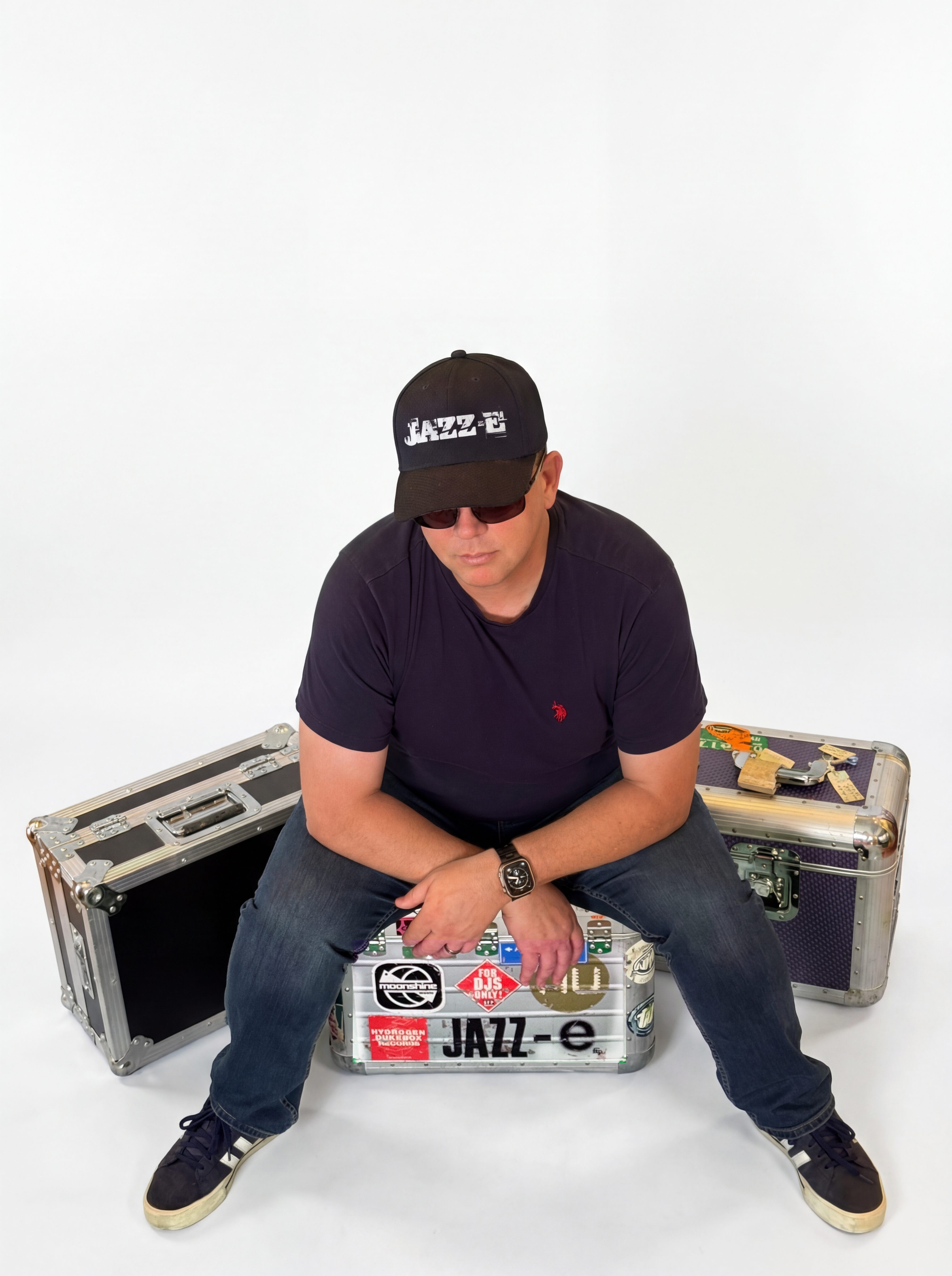 DJ Jazz-e sitting on his DJ cases